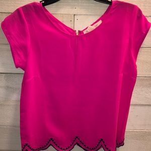 Neon pink top with navy trim